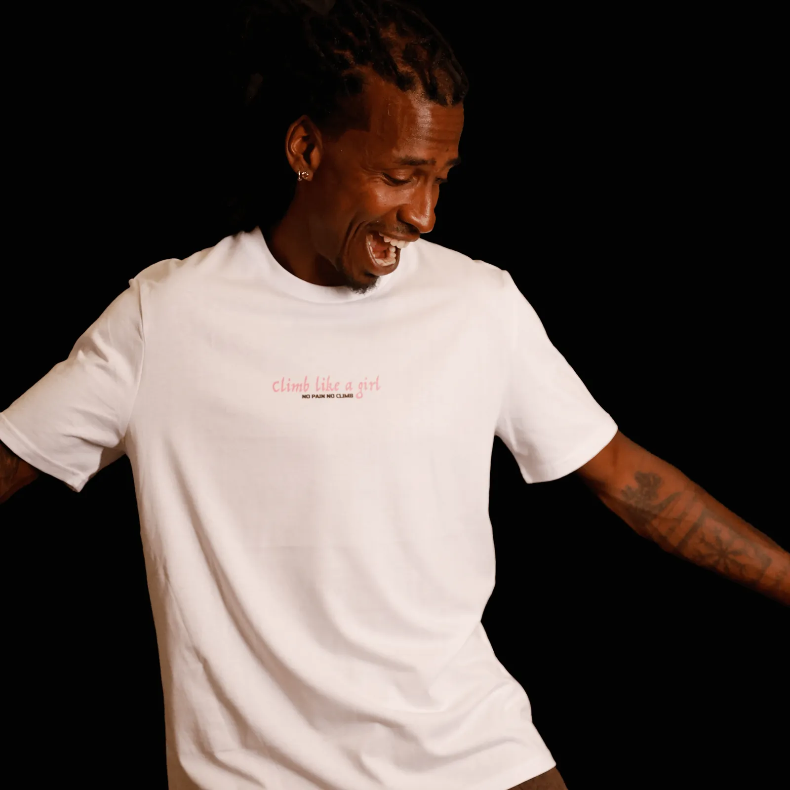 Man laughing in the white Climb Like A Girl t-shirt